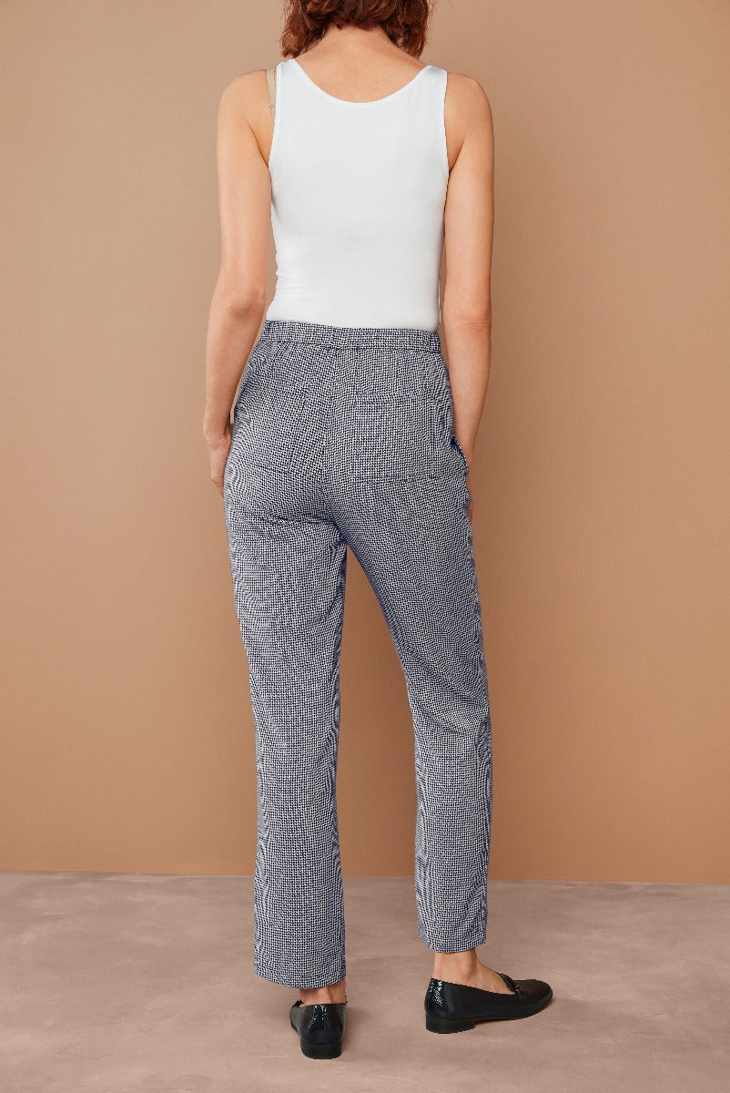 Lily Ella Collection women's textured grey trousers, casual fit, back view, styled with white tank top and black loafers