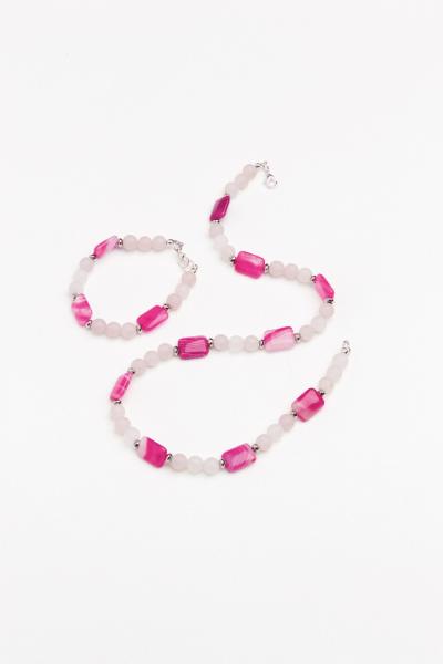 Lily Ella Collection pink and grey beaded necklace and bracelet set on white background
