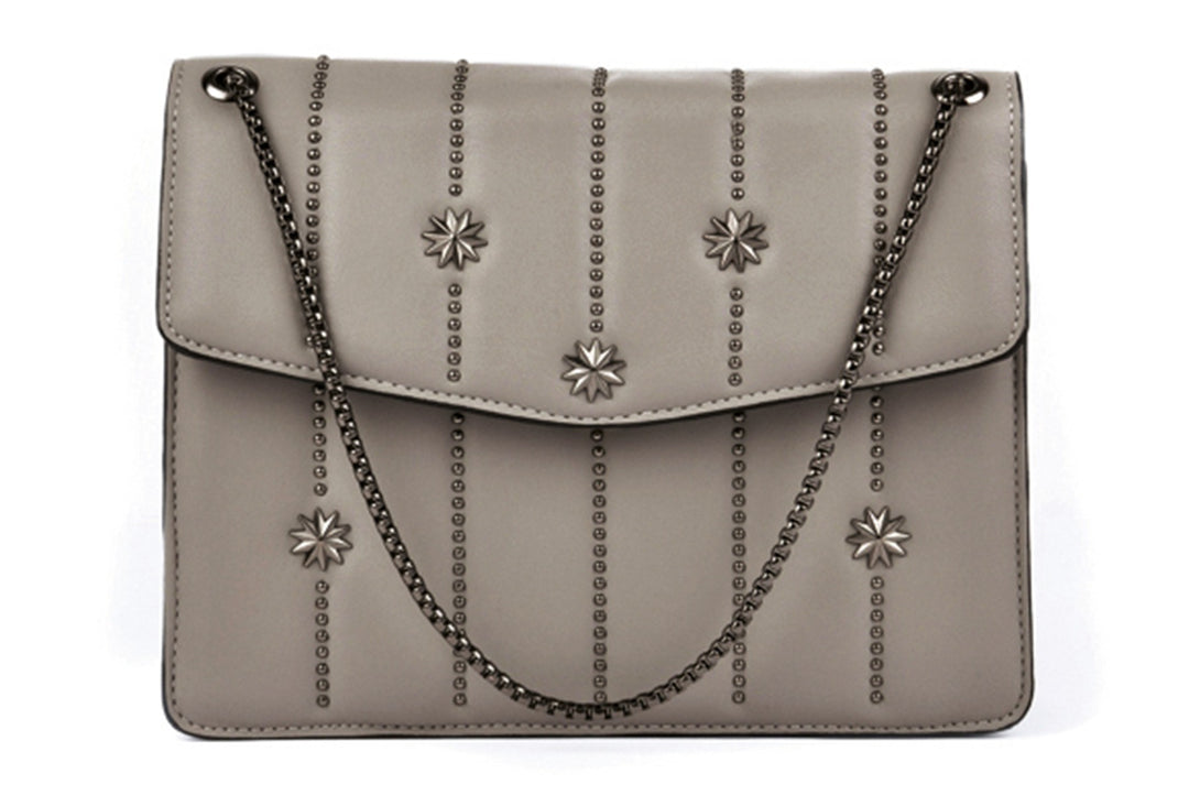 Lily Ella Collection taupe studded leather crossbody bag with floral accents and chain strap.