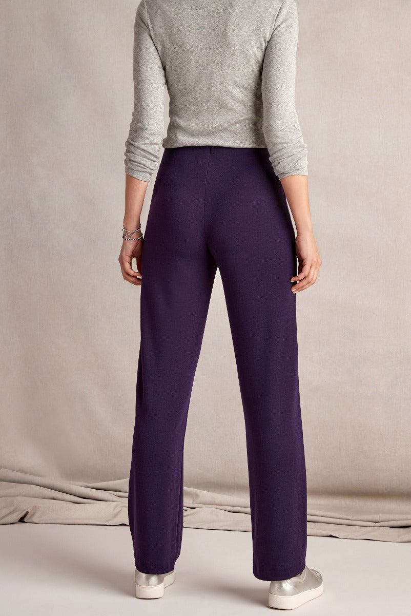Lily Ella Collection women's fashion, elegant purple wide-leg trousers, stylish comfortable pants, rear view with neutral background.