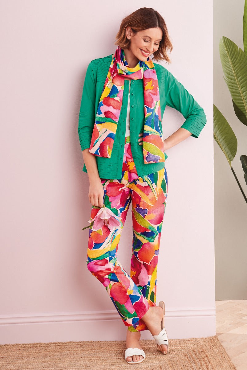 Lily Ella Collection vibrant floral printed trousers and blouse with coordinating green cardigan, stylish women's spring fashion, comfortable and chic outfit for mature women.