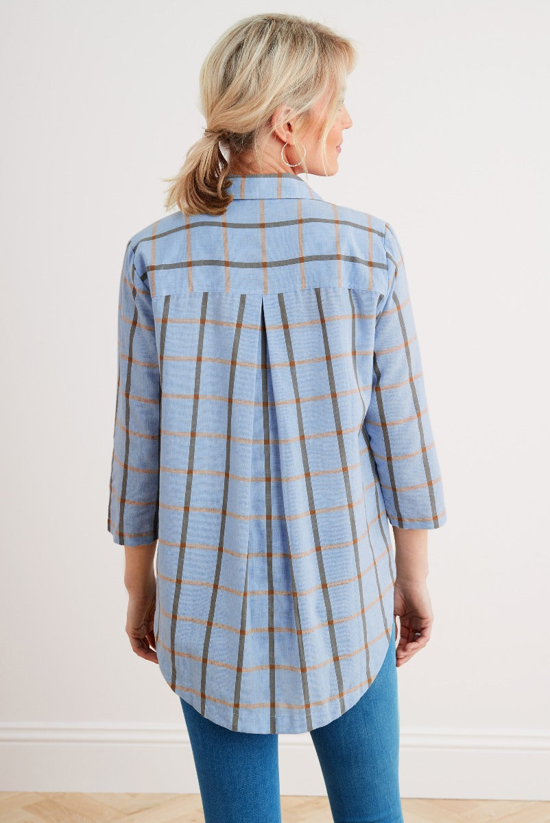 Lily Ella Collection light blue and tan checkered tunic blouse fashion rear view with jeans for women's casual wear.