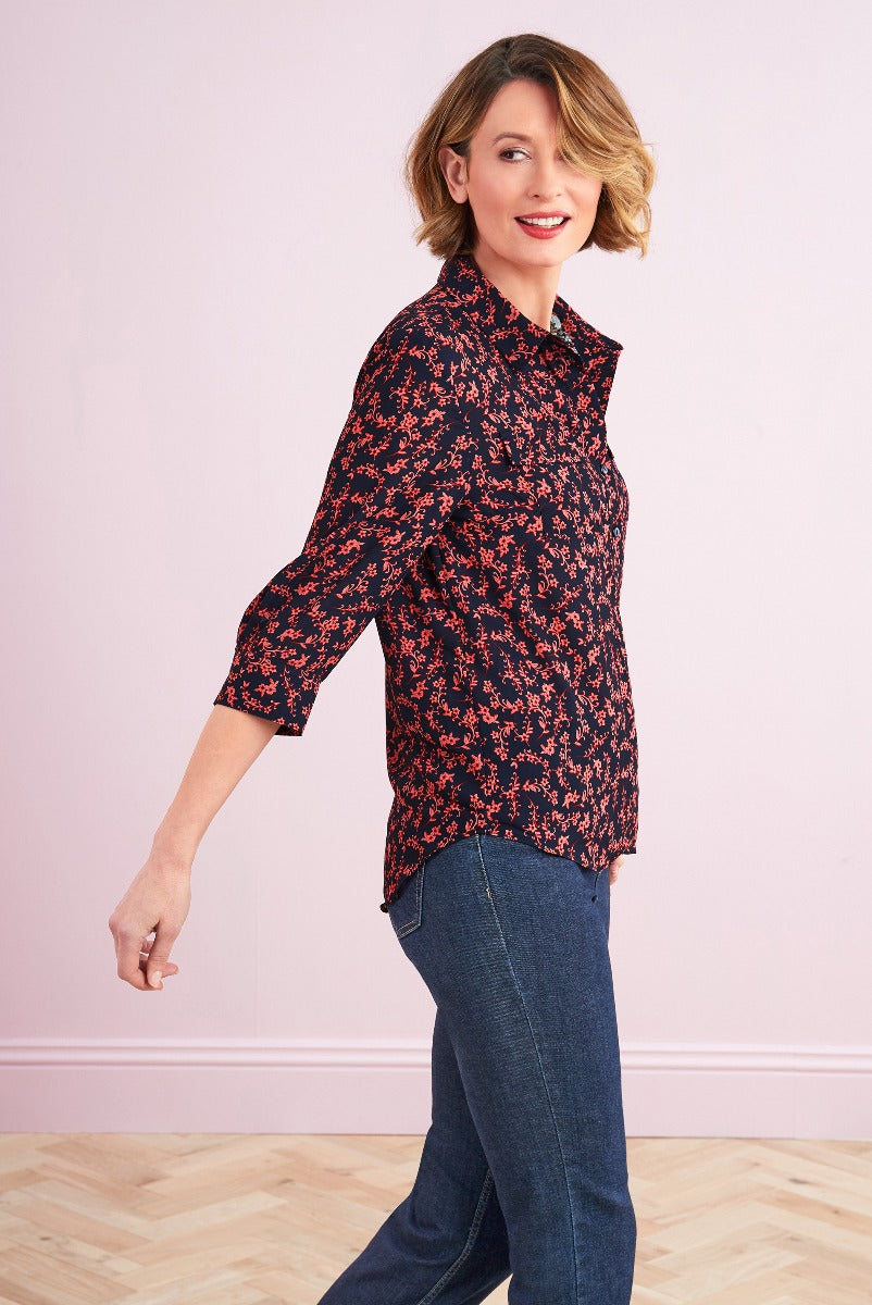 Lily Ella Collection floral print blouse in black and red, stylish 3/4 sleeve top, casual chic women's fashion, paired with classic denim jeans