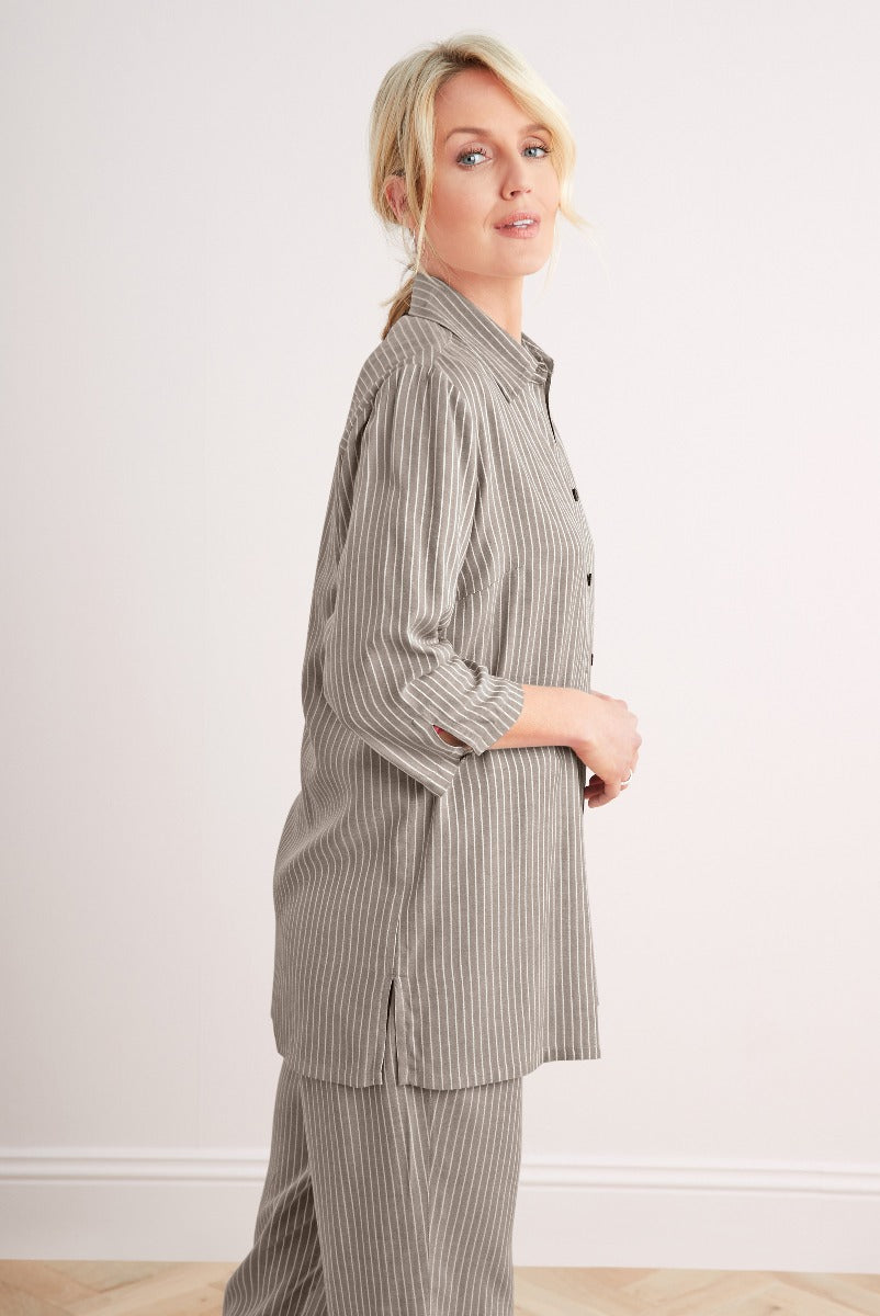 Lily Ella Collection grey striped shirt and trousers set, stylish women's casual wear, elegant office outfit with button-up top, model posing in modern minimalist fashion.