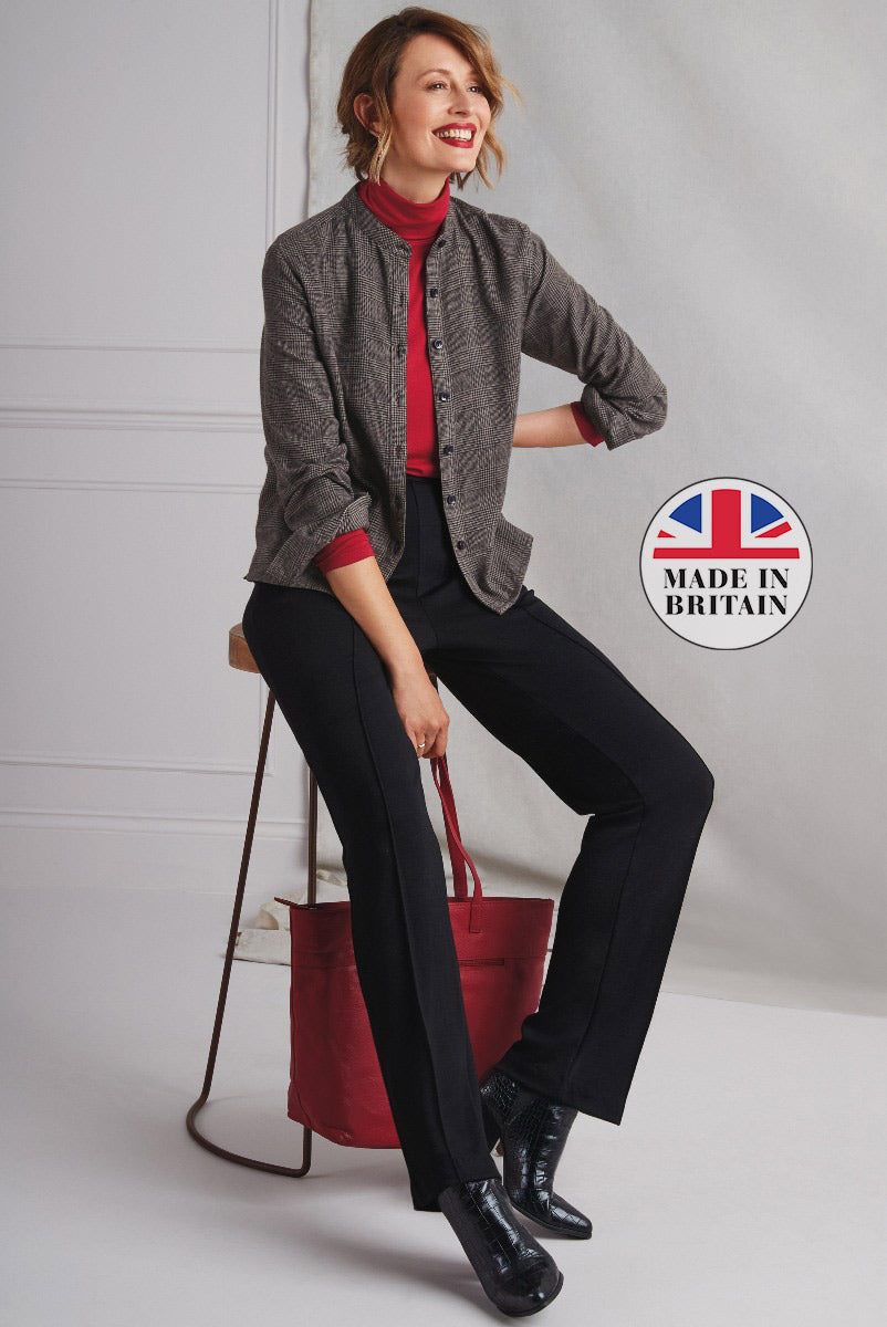 Lily Ella Collection chic casual outfit featuring grey tweed jacket, red turtleneck top, navy trousers, and black crocodile-patterned boots, accessorized with a red leather tote bag, Made in Britain label visible