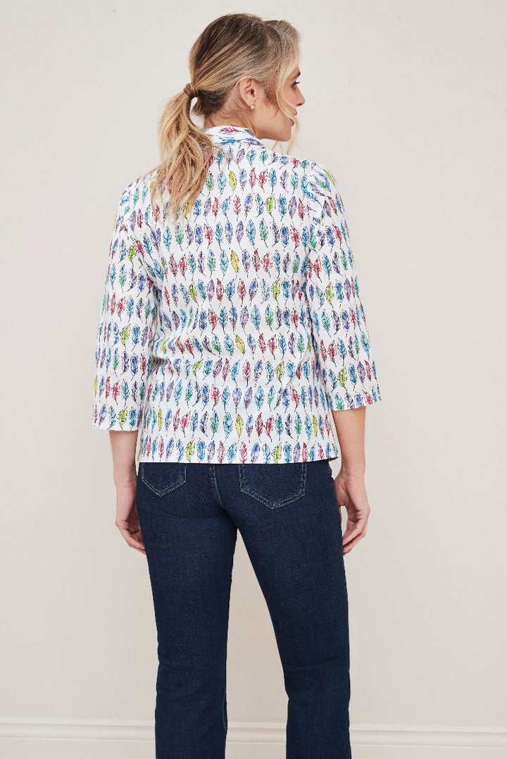 Lily Ella Collection colorful feather print shirt in white with three-quarter sleeves and classic collar, paired with dark blue denim jeans, women's casual fashion clothing