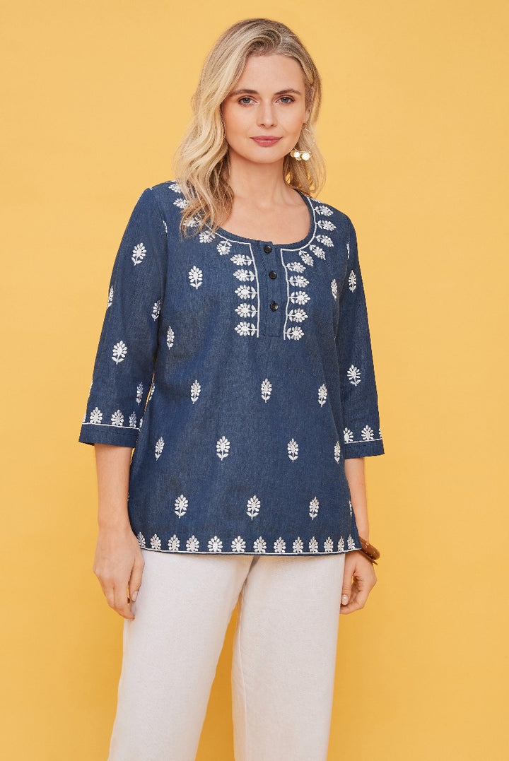 Lily Ella Collection navy blue embroidered tunic top, 3/4 sleeve, casual chic women's fashion, model wearing stylish summer blouse against yellow background.
