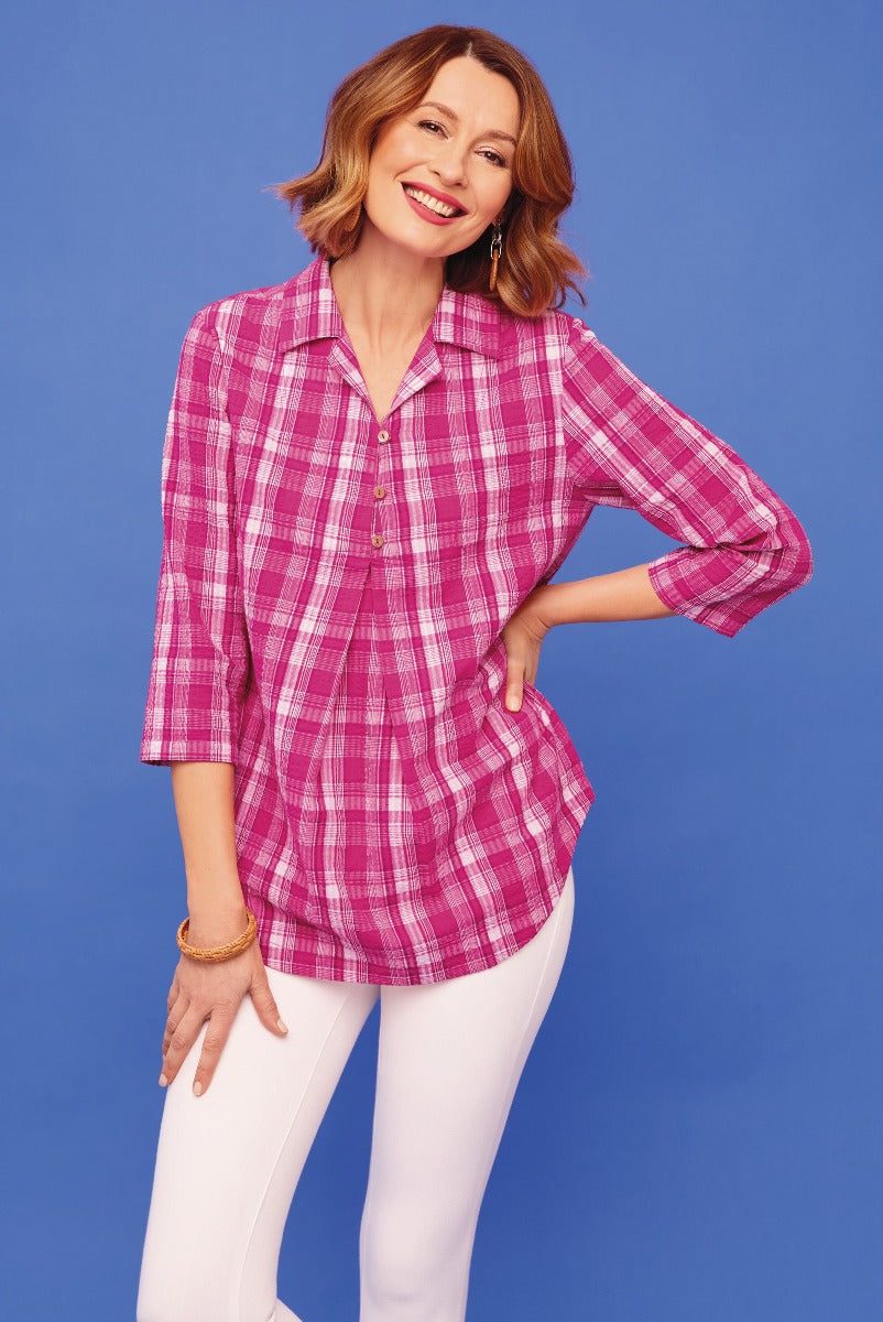 Lily Ella Collection pink plaid shirt, stylish 3/4 sleeve blouse, women's casual chic top, paired with white trousers.