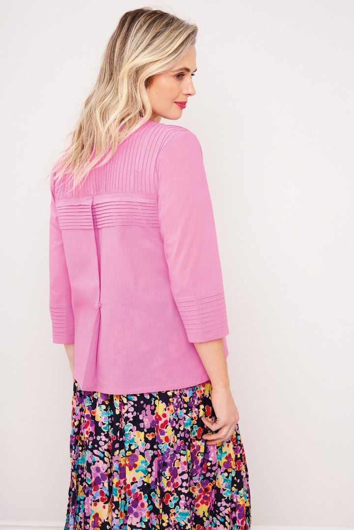 Lily Ella Collection pink ribbed cardigan paired with floral maxi skirt, stylish women's knitwear side view