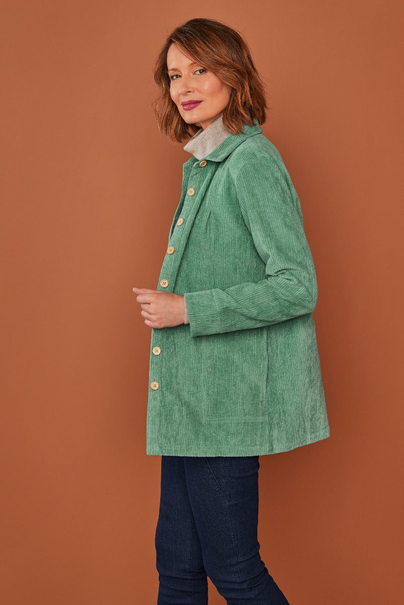 Lily Ella Collection sage green corduroy jacket with button front and collar layered over a casual shirt, paired with denim jeans, women's autumn fashion.