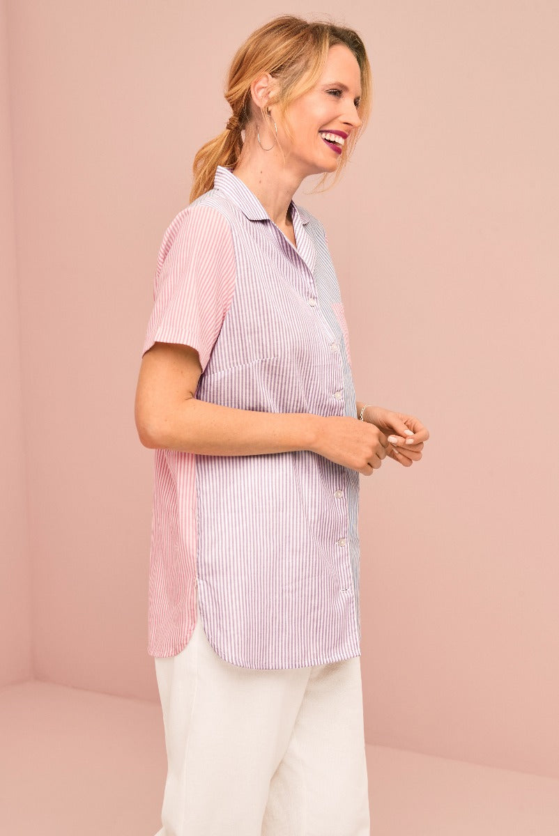 Lily Ella Collection women's fashion, smiling model wearing pink and white striped blouse with collar, casual chic style, paired with cream trousers.