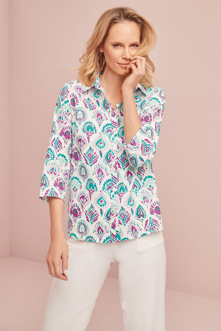 Lily Ella Collection paisley pattern blouse in turquoise and white, stylish women's casual wear, three-quarter sleeve length, paired with white trousers