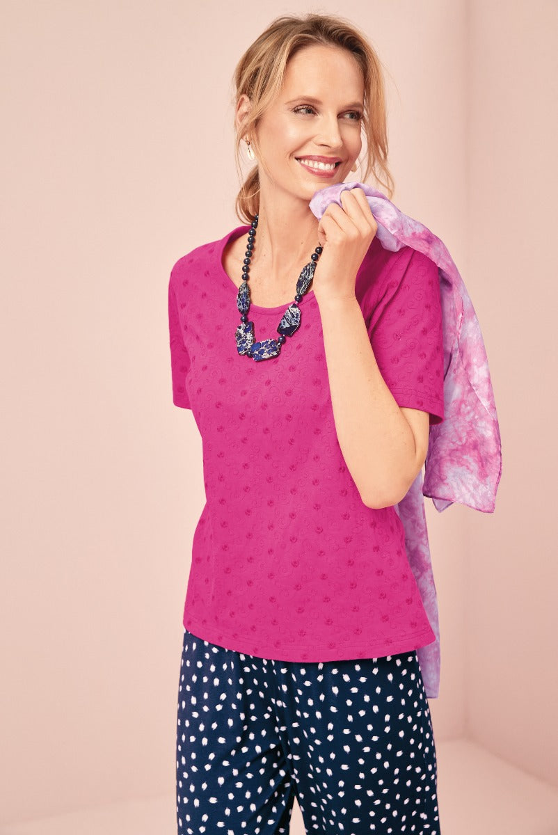 Lily Ella Collection fuchsia embroidered top with navy polka dot trousers and statement necklace for stylish women's casual wear.