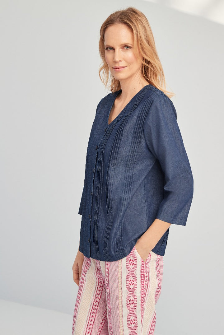 Lily Ella Collection stylish navy blue tunic top for women, 3/4 sleeve, casual chic, paired with patterned pink and white trousers.