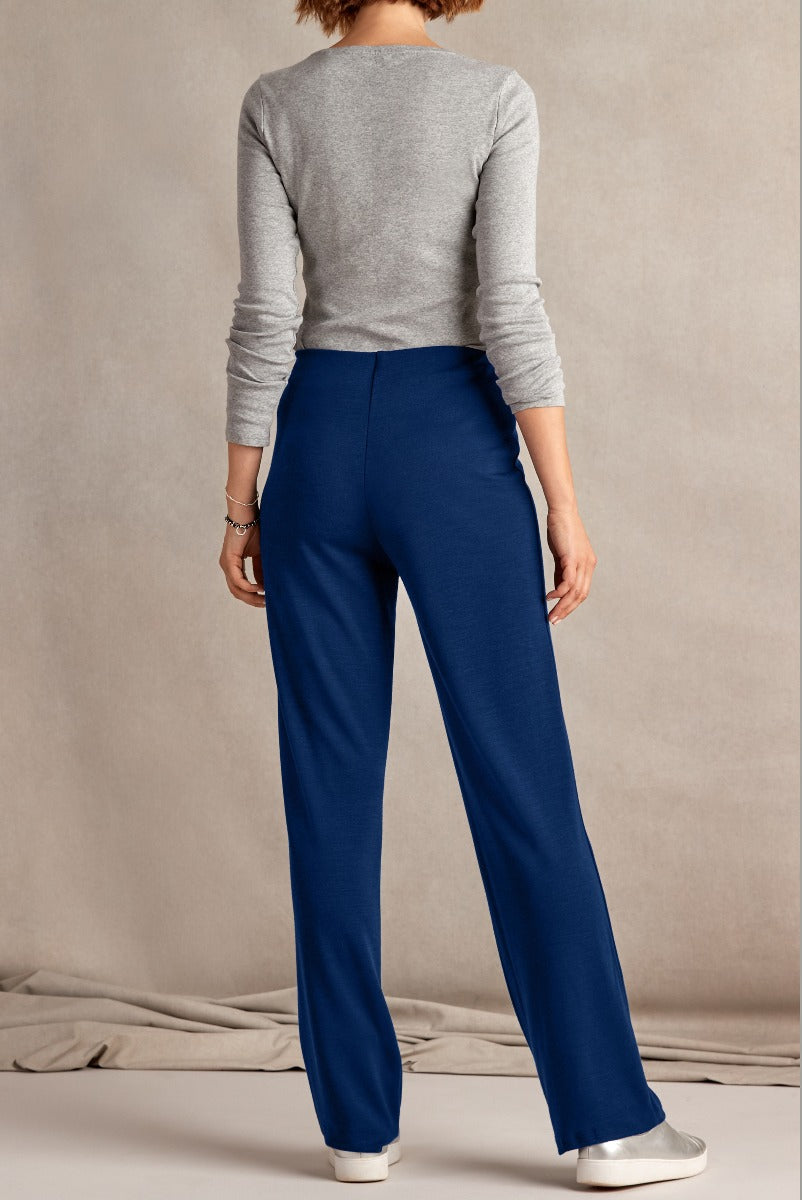 Lily Ella Collection elegant blue trousers for women, stylish high-waisted design, paired with grey top, professional and casual wear, model showcasing rear view.