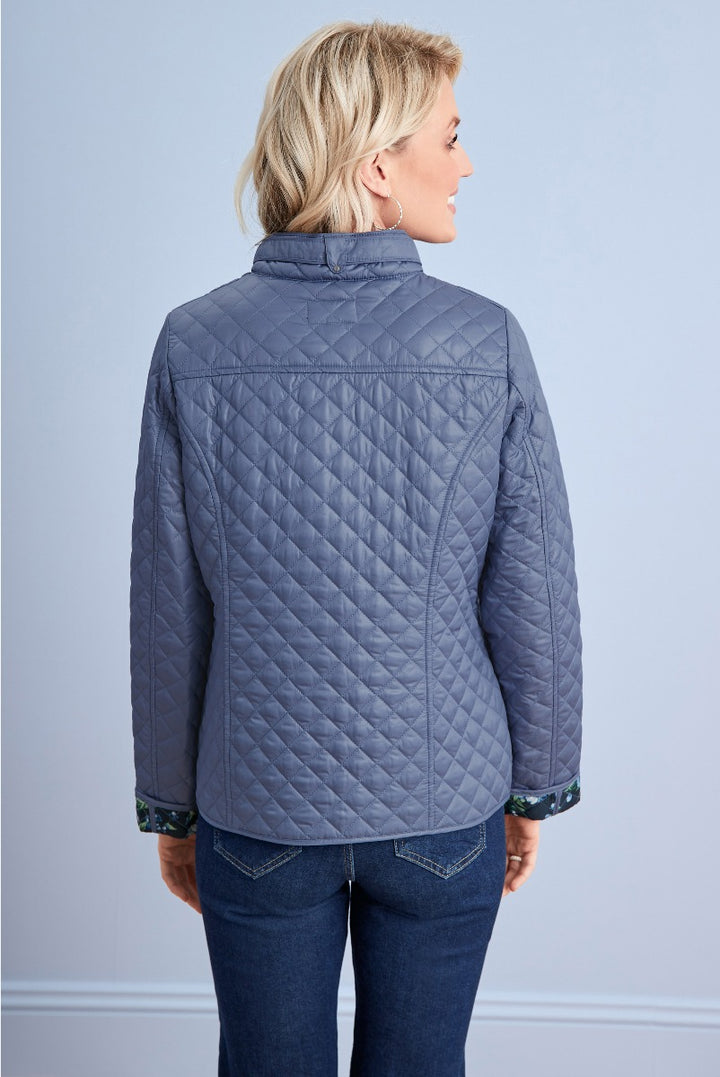 Lily Ella Collection quilted jacket, slate blue, comfortable fit, elegant style, floral cuff detail, women's fashion outerwear.