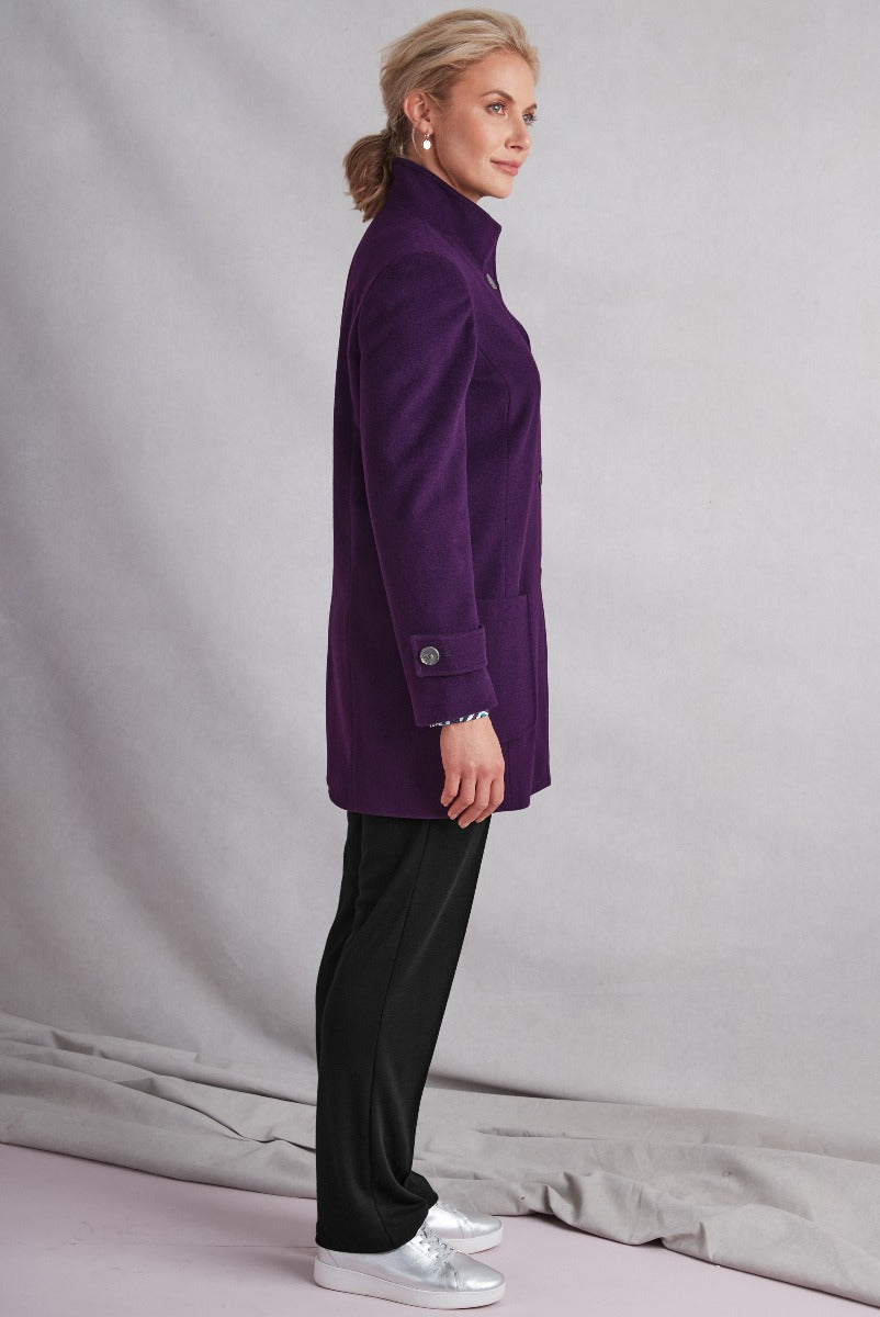 Lily Ella Collection elegant purple blazer for women, side view showcasing button detail and structured fit, paired with black trousers and silver sneakers.