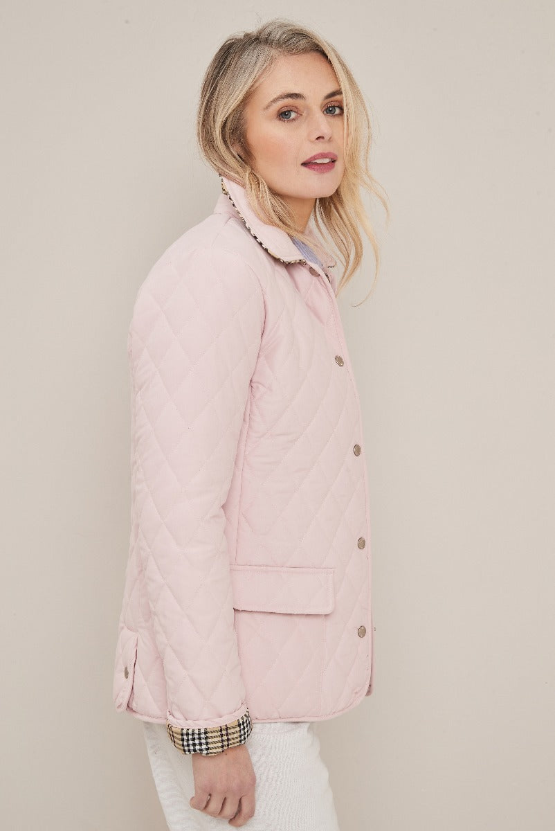 Lily Ella Collection lightweight pastel pink quilted jacket for women, featuring button-up front and checkered cuff detail.