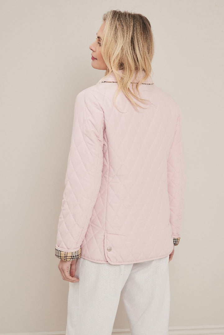 Lily Ella Collection pink quilted jacket, elegant spring outerwear for women, stylish pastel pink diamond-quilted design with chic plaid cuff detail, versatile casual to smart casual ladies' fashion piece.