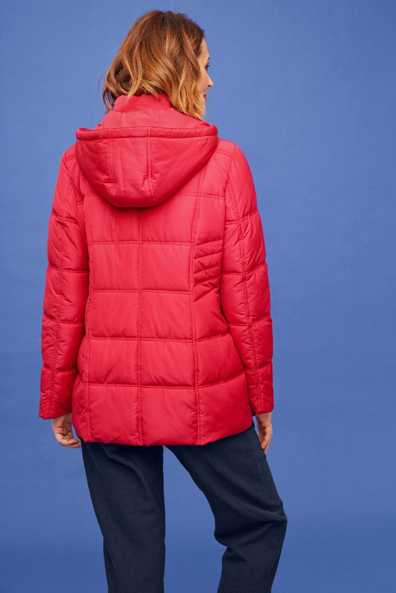 Lily Ella Collection vibrant red puffer jacket, women's winter outerwear, comfortable warm quilted coat with hood, casual style against blue background