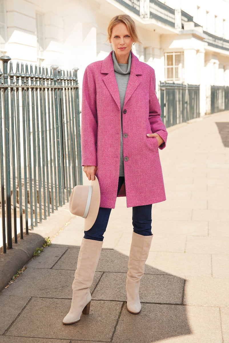 Lily Ella Collection pink wool-blend coat, stylish women's winter outerwear fashion with light grey turtleneck, navy trousers, and beige knee-high boots, accessorized with a cream hat, model posing in urban setting