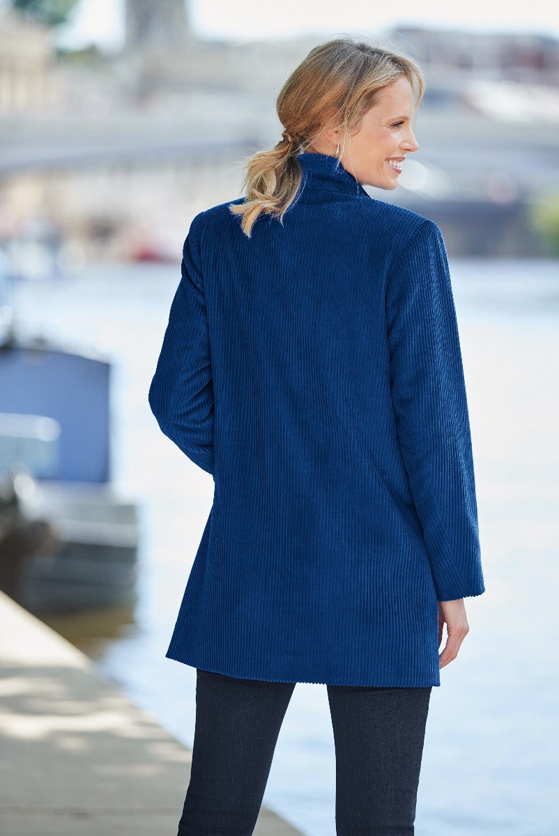 Lily Ella Collection navy blue textured tunic top on model by waterfront, stylish casual women's wear