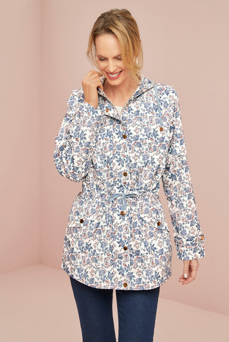 Lily Ella Collection floral blue and white print jacket on model pairing with denim, stylish women's outerwear, chic casual look, trendy fashion for spring