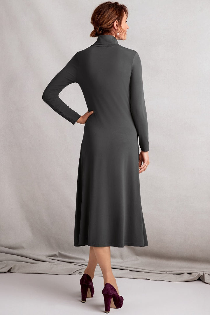 Lily Ella Collection elegant charcoal grey midi dress with high neckline and long sleeves, paired with purple velvet heels, women's fashion rear view.