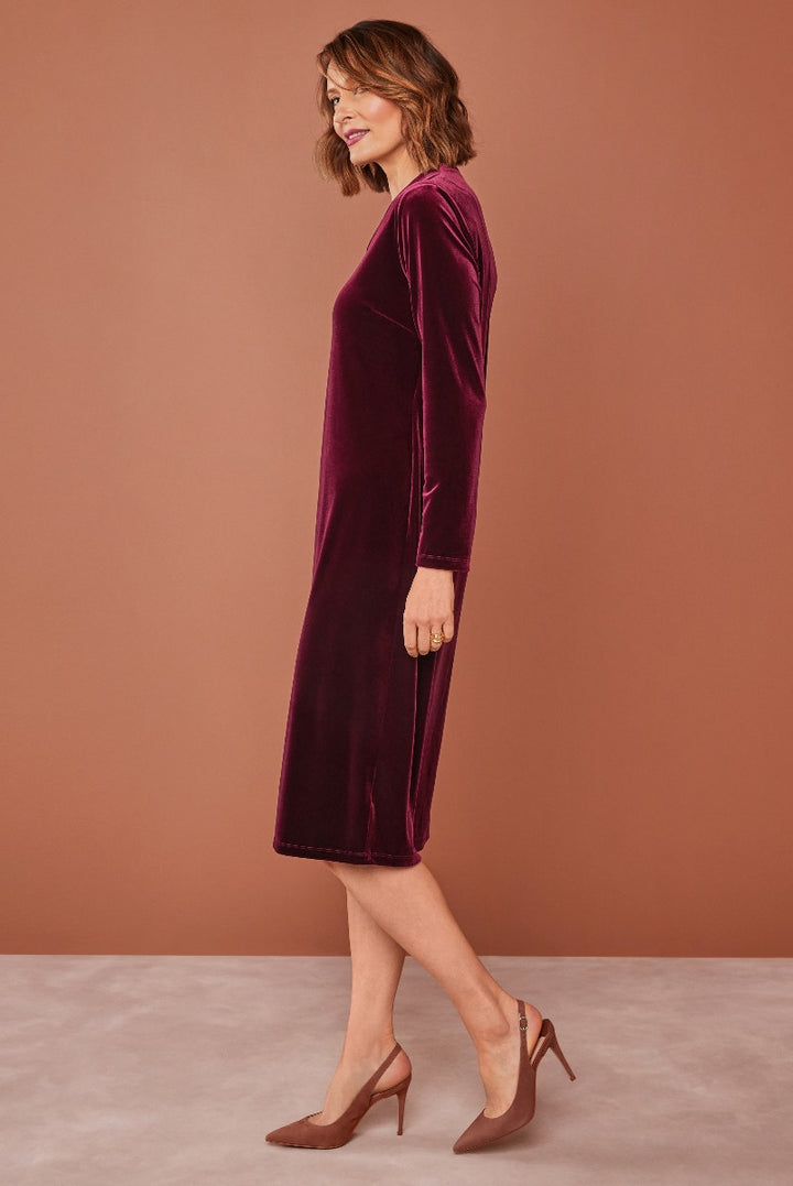 Lily Ella Collection elegant burgundy velvet midi dress with three-quarter sleeves, paired with brown pointed-toe heels, tasteful casual chic women's fashion.