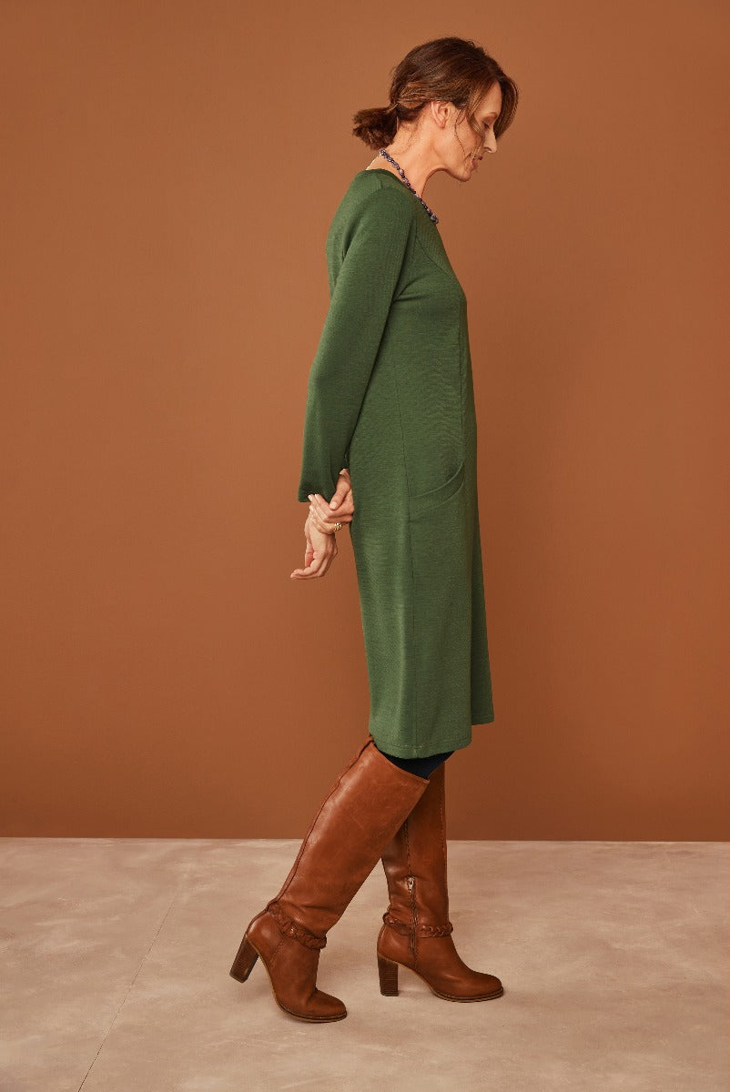 Lily Ella Collection green longline cardigan style knitwear on model with brown leather boots for stylish women's autumn fashion.