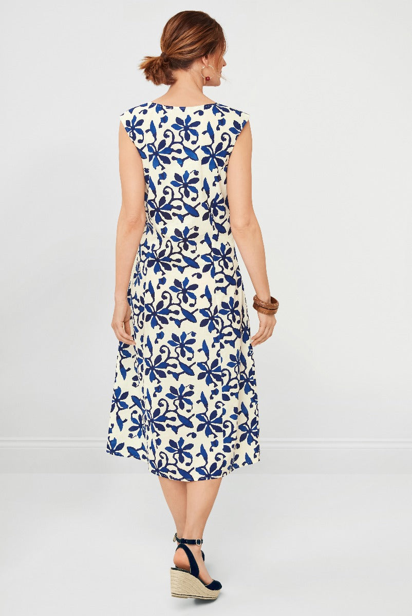 Lily Ella Collection navy and white floral print midi dress for women, spring summer fashion, elegant daytime dress with sleeveless design and wedge heels.
