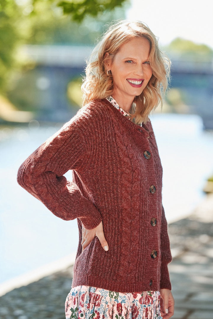 Lily Ella Collection women's terracotta cable knit cardigan paired with floral skirt, stylish autumn fashion, button-up knitwear for outdoor elegance