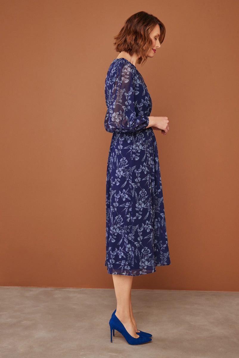 Lily Ella Collection navy blue floral midi dress with sheer sleeves paired with matching blue heels for elegant women's fashion.