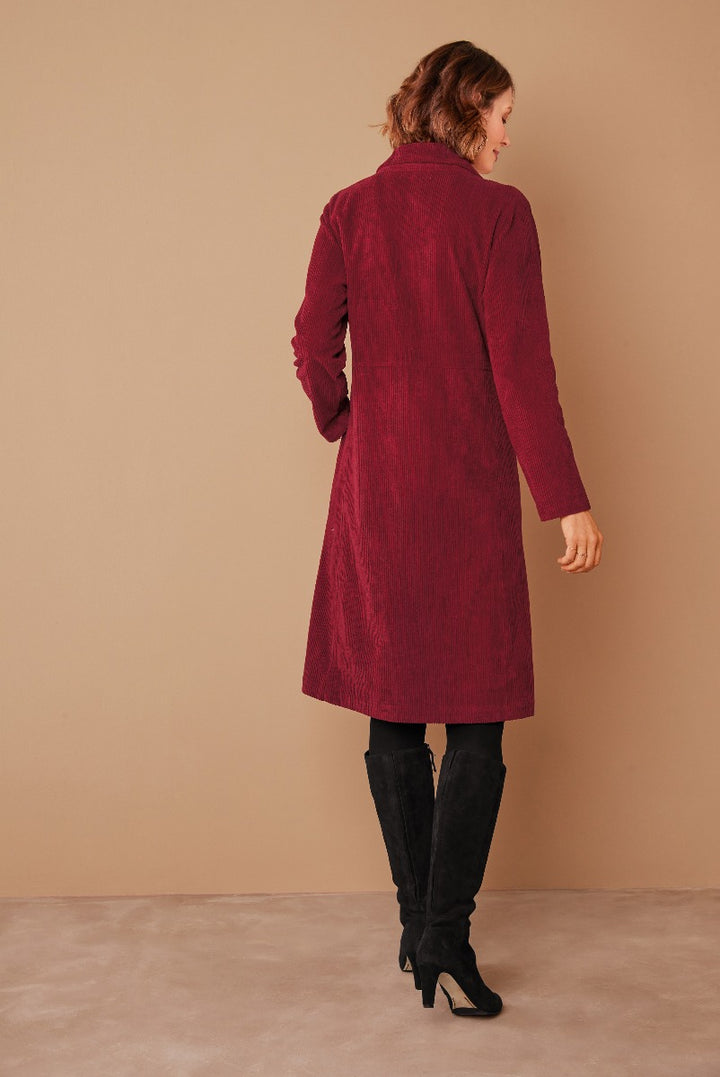 Lily Ella Collection elegant burgundy textured long coat paired with black over-the-knee boots for a stylish autumn/winter look.