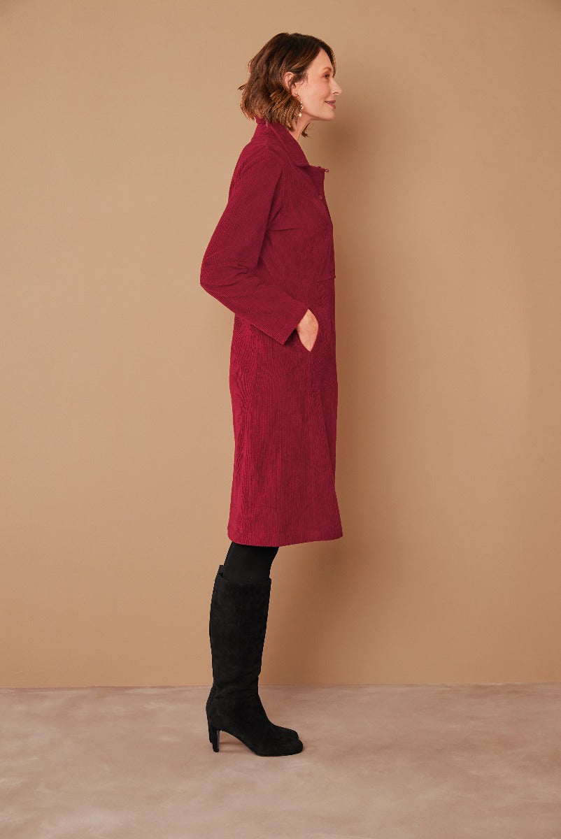 Lily Ella Collection elegant maroon textured coat with pockets paired with black knee-high boots for a stylish autumn attire