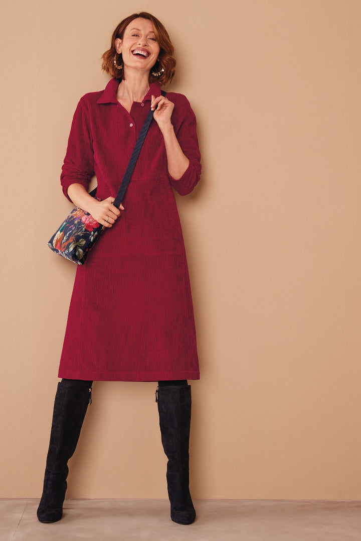 Lily Ella Collection maroon corduroy shirt dress paired with black knee-high boots and crossbody bag for a feminine autumn look