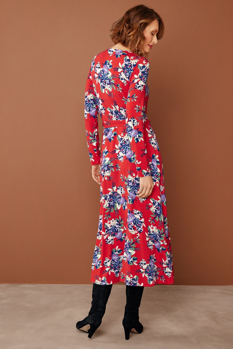 Lily Ella Collection vibrant red floral dress, mid-length with long sleeves, styled with black boots, elegant casual women's fashion.