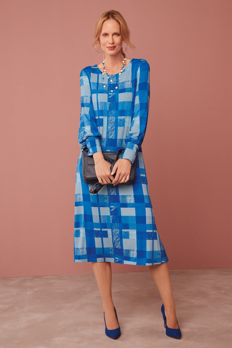 Lily Ella Collection blue patchwork midi dress styled with coordinating heels and accessories, featuring fashion-forward design and elegant casual wear for women