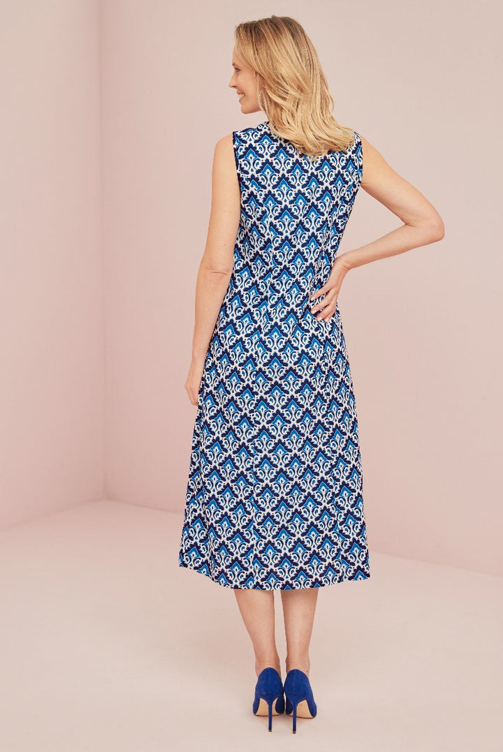 Lily Ella Collection stylish blue and white patterned midi dress for women, elegant sleeveless design with matching blue heels, perfect for spring and summer wardrobe.