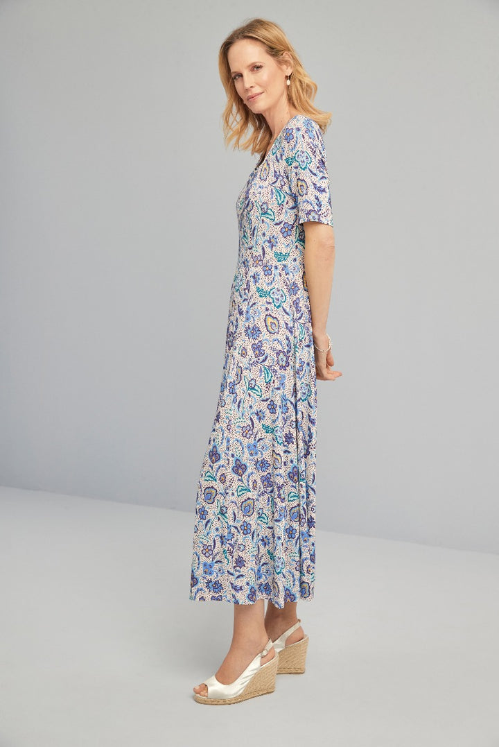 Lily Ella Collection floral print midi dress in blue and purple, elegant summer style, women's fashion, model wearing versatile daytime outfit with wedge sandals