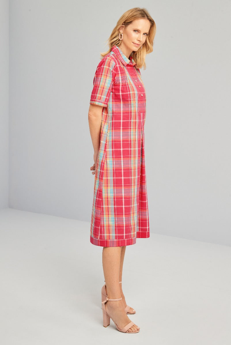 Lily Ella Collection red and blue plaid shirt dress, mid-length with short sleeves and collar, styled with elegant nude ankle strap heels