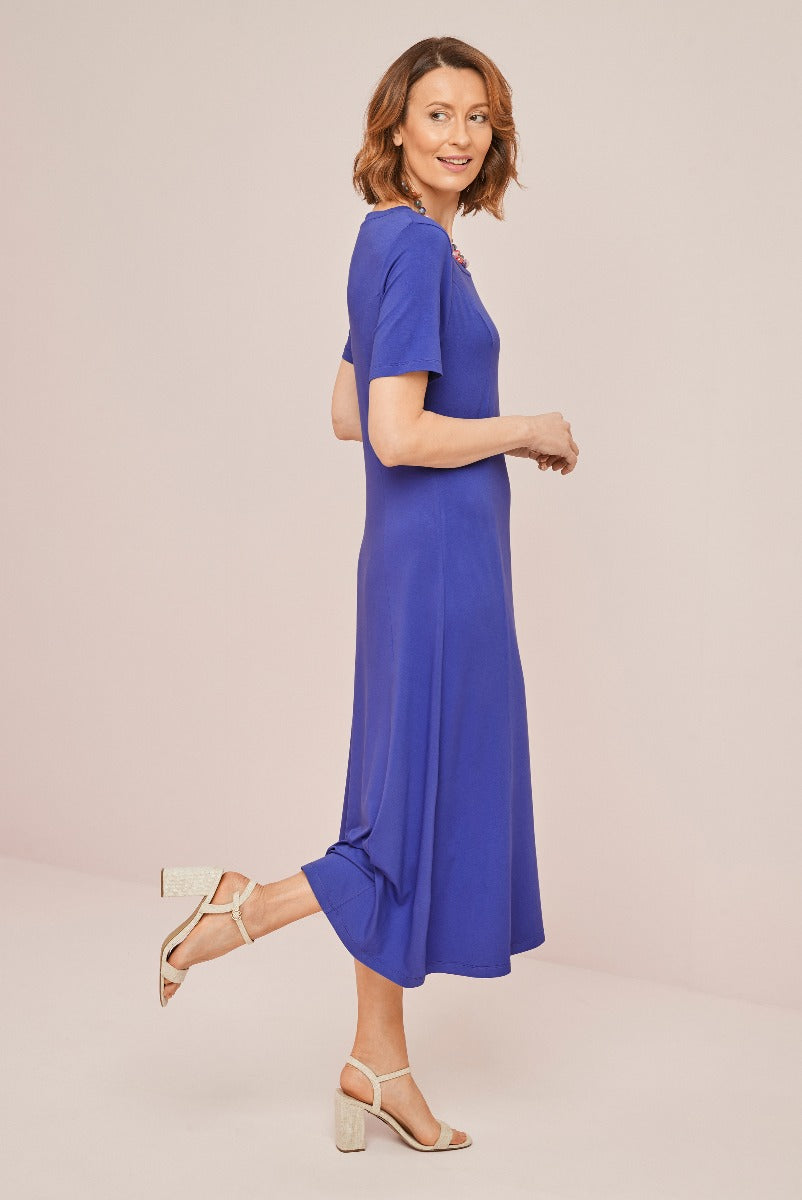 Lily Ella Collection elegant royal blue midi dress, women's stylish summer outfit, comfortable short-sleeve design, paired with beige heeled sandals.
