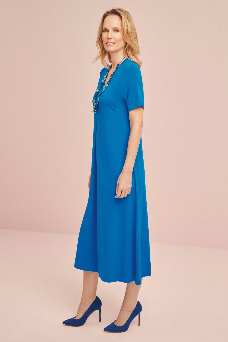 Lily Ella Collection elegant royal blue midi dress with short sleeves and matching heels, stylish women's fashion, professional model showcasing clothing line.