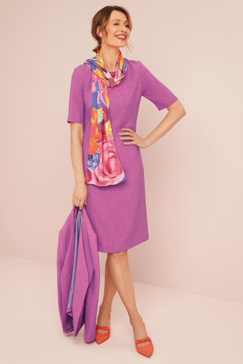 Lily Ella Collection elegant purple shift dress with colorful floral scarf and coordinating cardigan, model showcasing women's spring outfit with stylish orange heels.