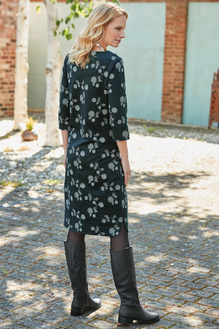 Lily Ella Collection navy floral print dress paired with black knee-high boots, featuring a mid-length cut and three-quarter sleeves, ideal for casual chic women's autumn fashion.