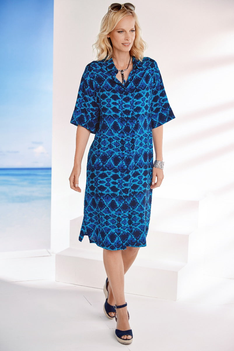 Lily Ella Collection blue patterned midi dress with V-neck and elbow-length sleeves, paired with navy heeled sandals and accessories for a chic summer look