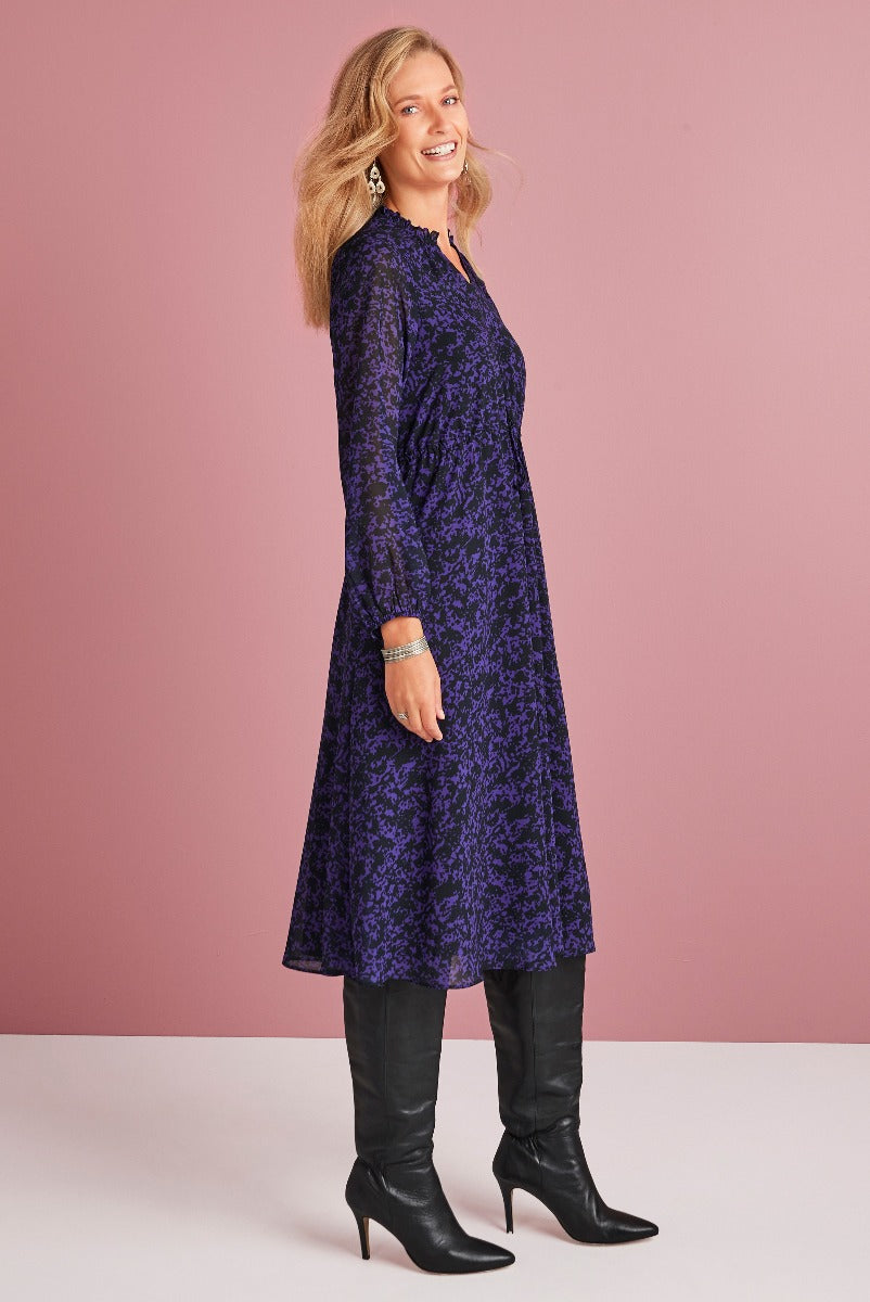 Lily Ella Collection elegant navy and purple floral midi dress paired with black knee-high boots for a sophisticated look