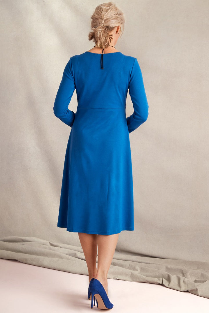 Elegant Lily Ella Collection royal blue knee-length dress with three-quarter sleeves and back zipper, paired with matching blue heels, perfect for sophisticated women's fashion.