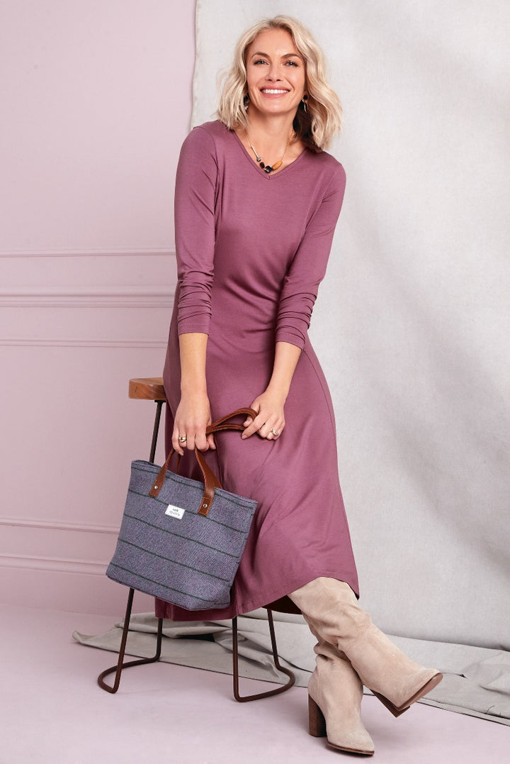Lily Ella Collection elegant mauve midi dress with long sleeves paired with beige knee-high boots and grey tweed tote bag for a chic autumn look