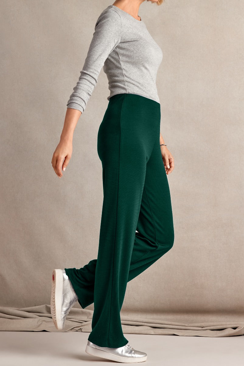 Lily Ella Collection green wide-leg trousers for women, comfortable casual fit trousers paired with grey top and silver sneakers, elegant and versatile clothing for modern style.